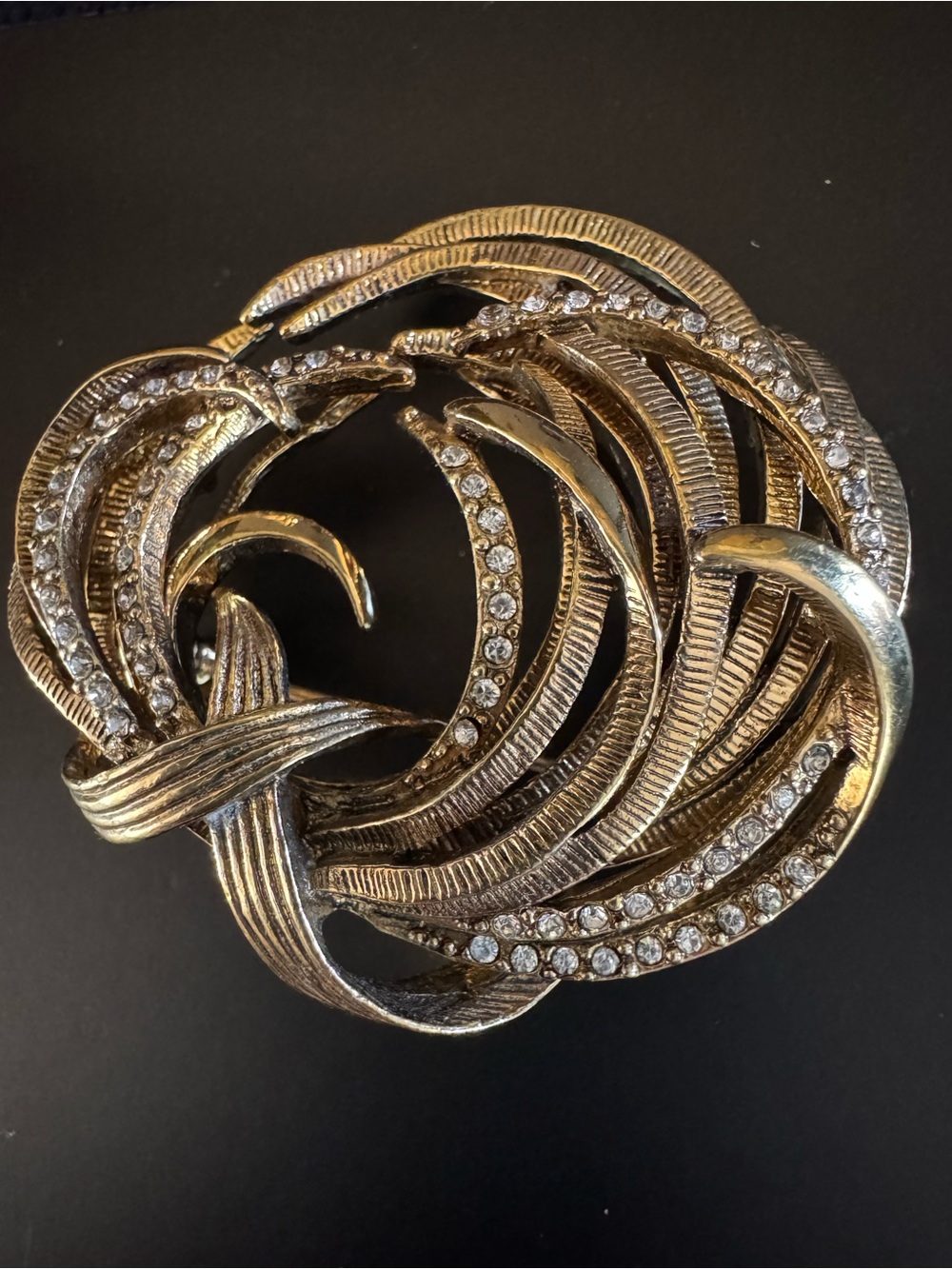 Vintage Monet Gold Tone Rhinestone Swirl Brooch